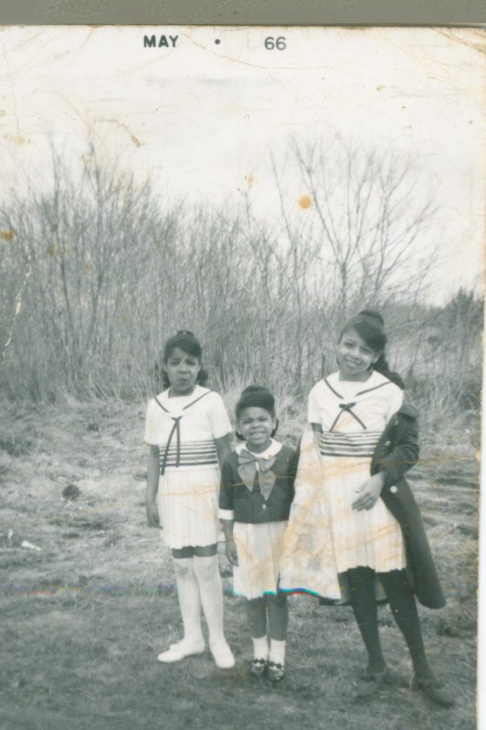 Nisi and their two younger sisters, Julie and Gina, in their Easter outfits on Gransie and Grandfather's farm near Bloomingdale, Michigan