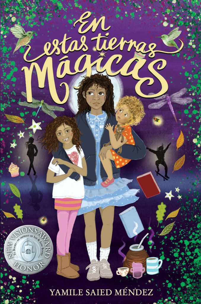 Cover of En estas tierras mágicas, showing a young lady with two children. They stand in front of a purple background with green speckled leaves and stars around the edges of the frame. A few steaming mugs and what looks like a cauldron sit at their feet. A couple of books, dragonflies, and fairy silhouettes float in the background.