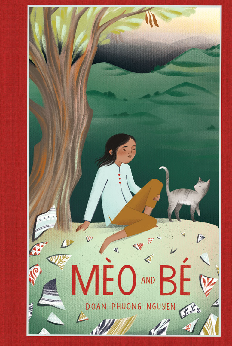 Cover of Mèo and Bé, showing a young girl sitting under a tree with a grey cat beside her. The grass beneath them is covered in what looks like pieces of broken plates with different patterns on them.